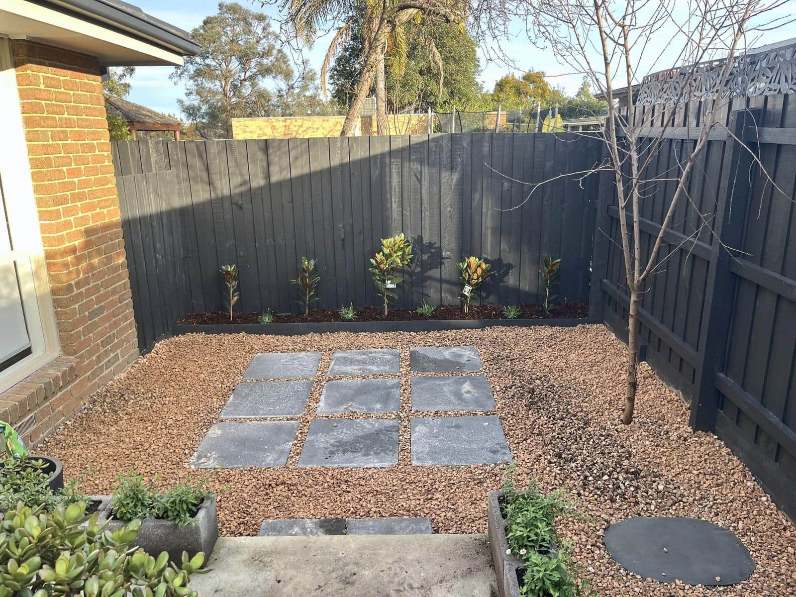 Gravel courtyard with square pavers and new planting, Forest Hill