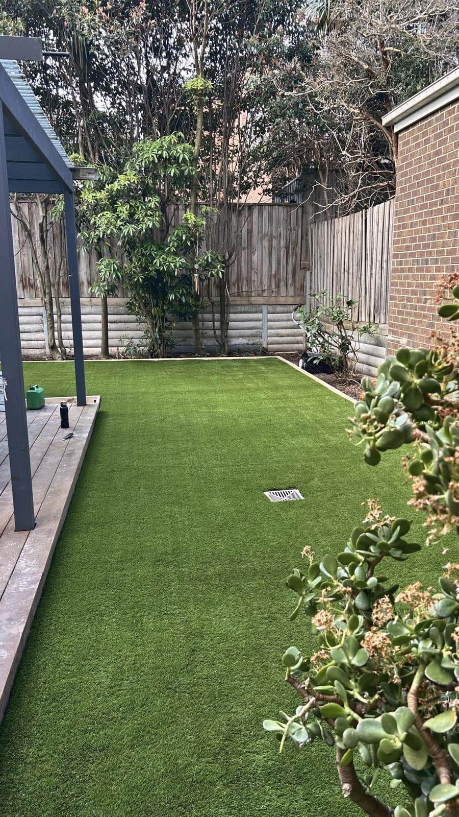 Synthetic lawn running past the deck to the back fence, Burwood