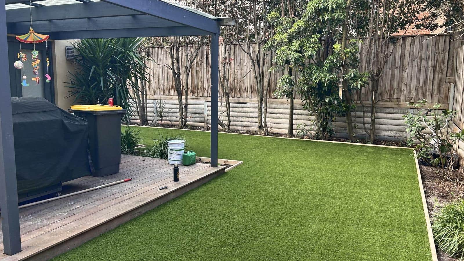 Synthetic lawn wrapping around the deck and pergola, Burwood